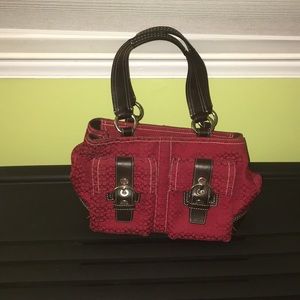 Red coach bad with matching wallet.